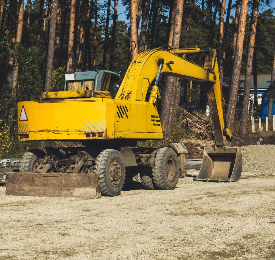 Yellow excavator on a construction site